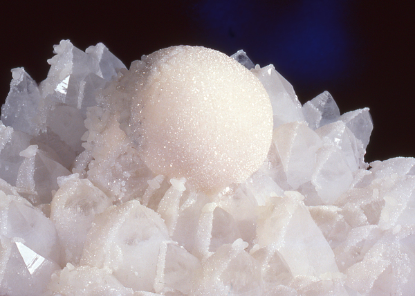 Calcite ball on quartz crystals from Romania